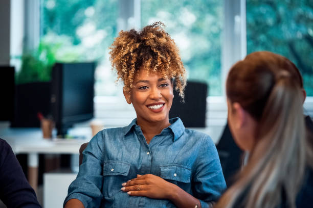 istock Smiling pregnant woman working in new office 1141404821