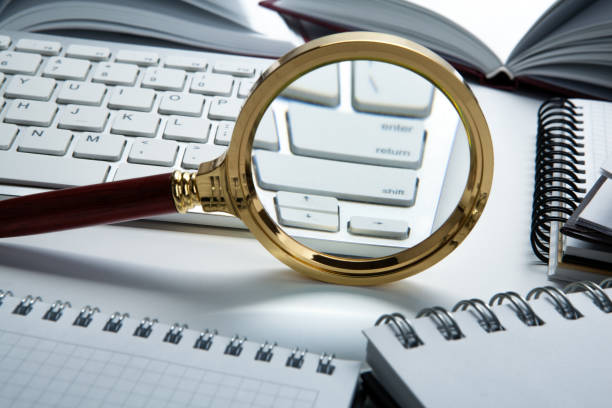 istock magnifying glass on the pc keyboard search technology concept 1141404913