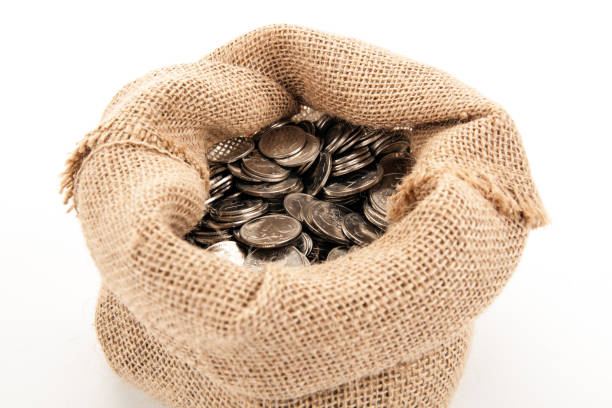 istock Russian ruble coins in a bag on a white background 1141405552