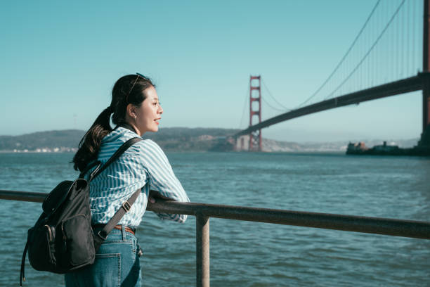 istock girl backpacker smiling enjoy sightseeing 1141407714