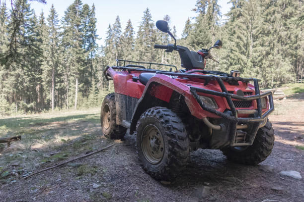 istock red quad bike in the forest, close-up, side and front view 1141408389