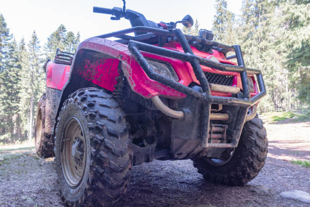 istock red quad bike in the forest, close-up, side and front view 1141408460