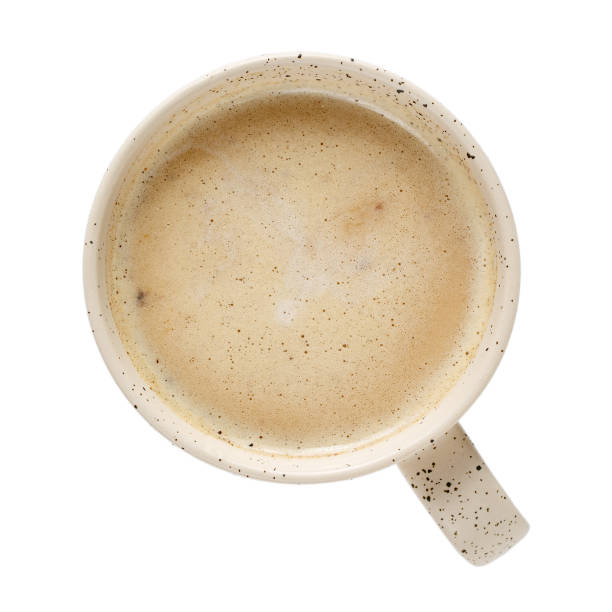 istock Cup of coffee isolated on white. Top view, close-up. 1141409575