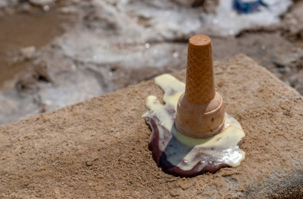 istock Ice cream cone has dropped upside down on the sidewalk on the ground. 1141410769