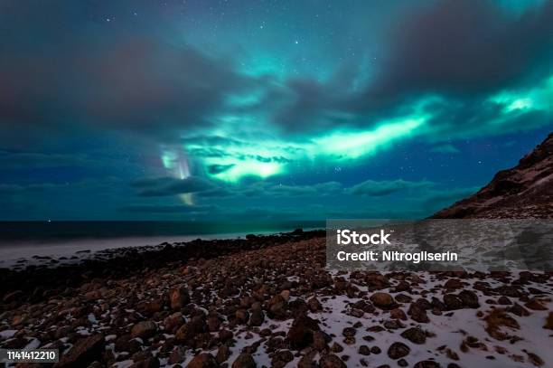 Northern Lights In Unstad Stock Photo - Download Image Now - Lofoten, Arctic, Aurora Borealis