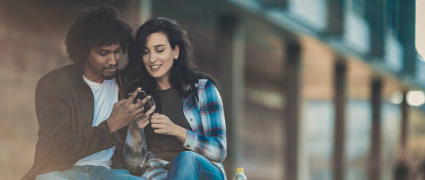 istock Beautiful young couple having fun outdoors on a lovely day 1141412458