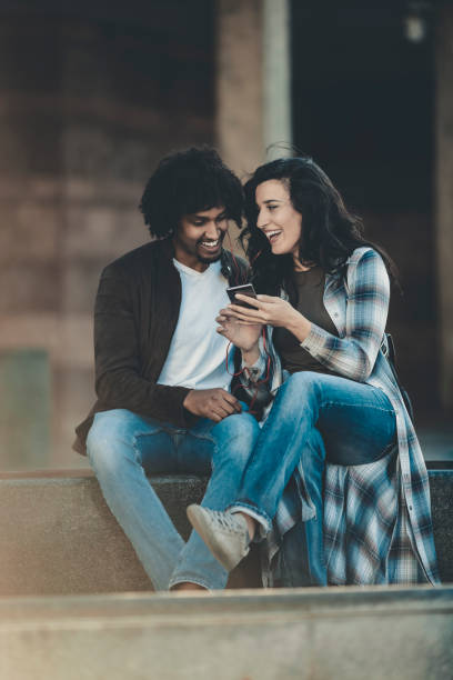 istock Beautiful young couple having fun outdoors on a lovely day 1141412601