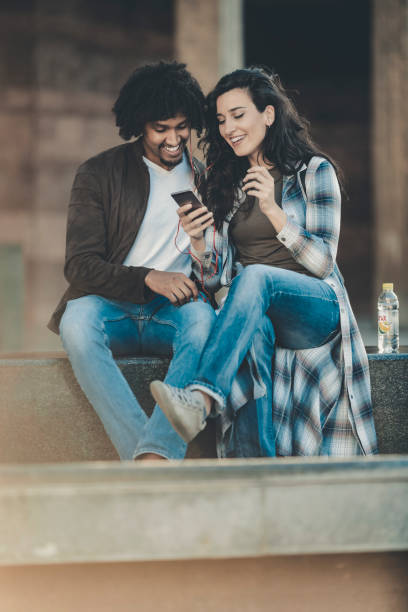 istock Beautiful young couple having fun outdoors on a lovely day 1141412685