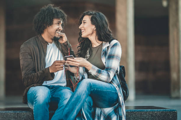 istock Beautiful young couple having fun outdoors on a lovely day 1141412839