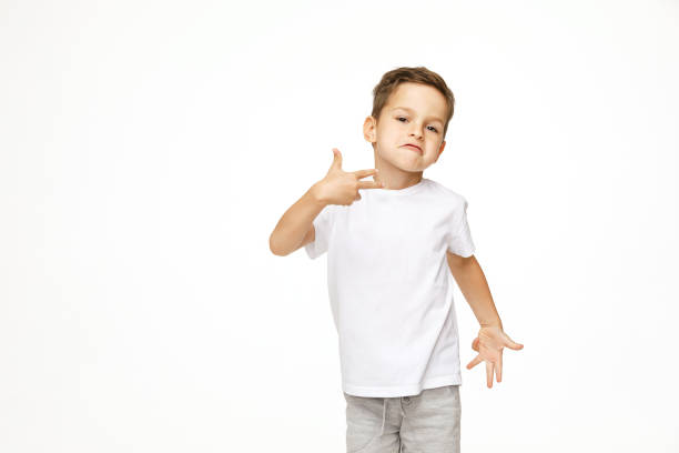 istock beautiful boy is dancing on a white background 1141415036