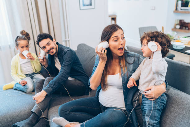 istock Family having fun with string phones 1141415360