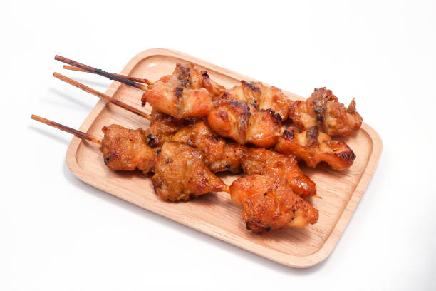 istock Chicken butt grilled on wooden plate isolated on white background 1141416065