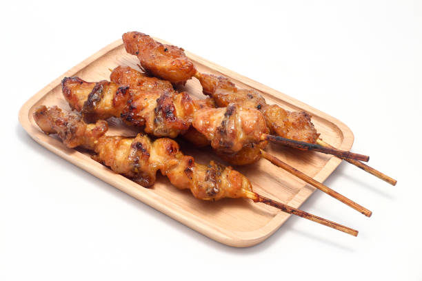 istock Chicken butt grilled on wooden plate isolated on white background 1141416128