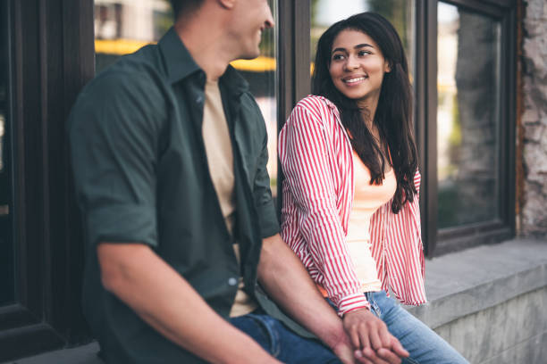 istock Long haired woman looking at beloved man and smiling 1141417358