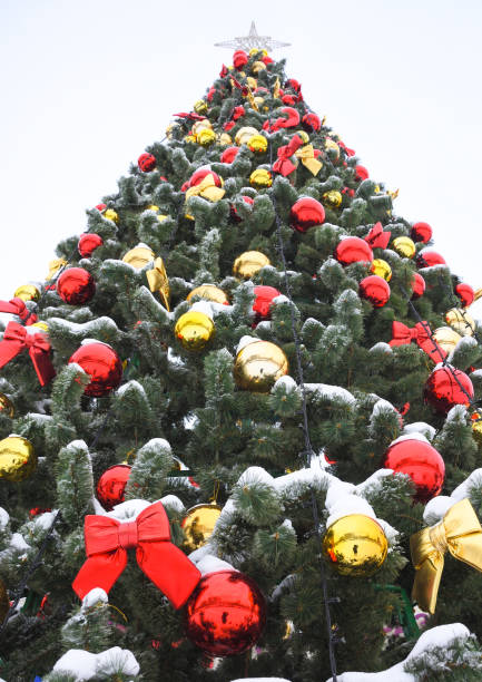 istock toys on the Christmas tree, colored balls and red bows on xmas tree 1141417536