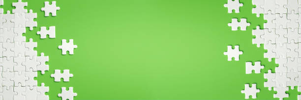 istock White details of puzzle on green background 1141417897