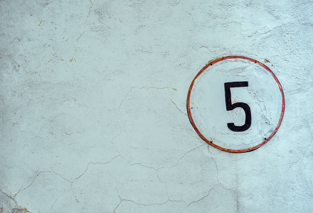 istock White Shabby Round Metal Plate With Black Number Five, Nailed On Whitewashed Concrete Wall 1141418097