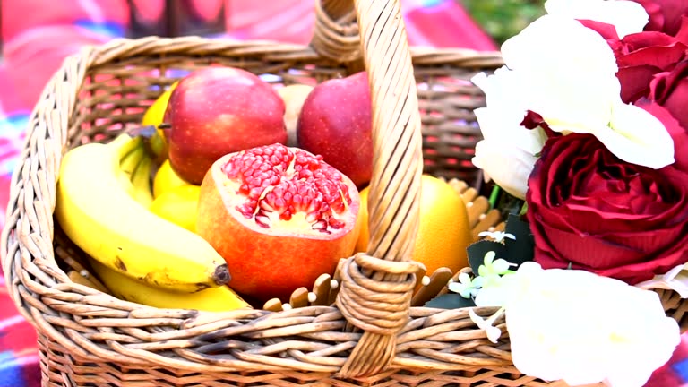 Picnic wicker basket with food on beach