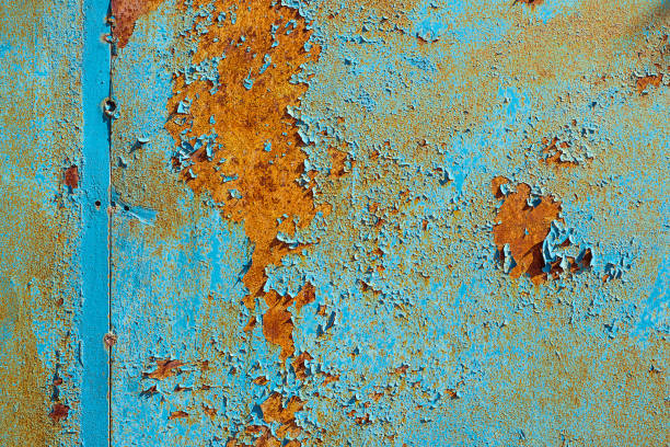 istock Texture of rusty metal, painted blue which became orange from rust. Horizontal texture of cracked paint on rusty steel 1141418950