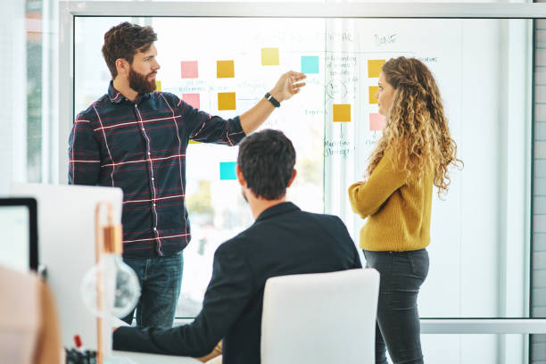 istock Working meticulously on their plans for success 1141421595