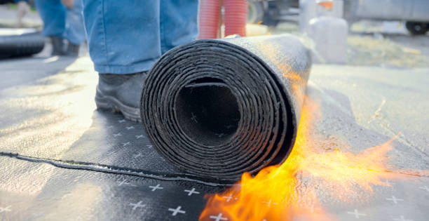 istock Heating and melting of bitumen rolls 1141421909