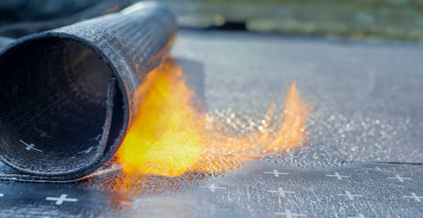 Heating and melting of bitumen rolls Close-up of heating and melting of bitumen rolls. waterproof photos stock pictures, royalty-free photos & images