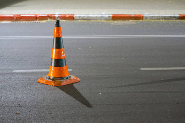 istock Road cone on the asphalt. Red caps on the road 1141422085