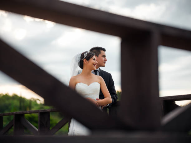 istock Happy newlywed cuple looking away and smiling 1141424502