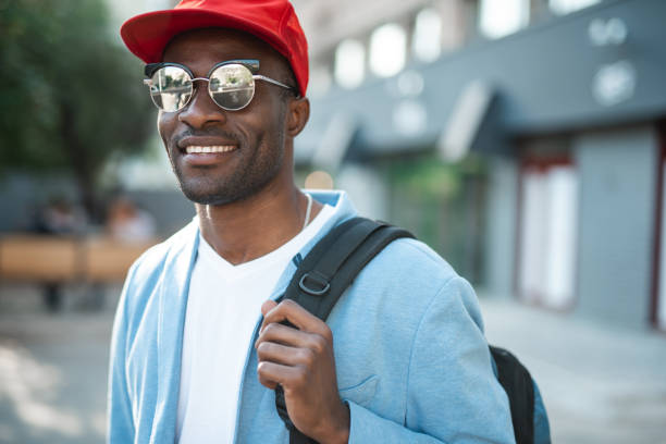 istock Beaming man holding luggage in arms 1141427298