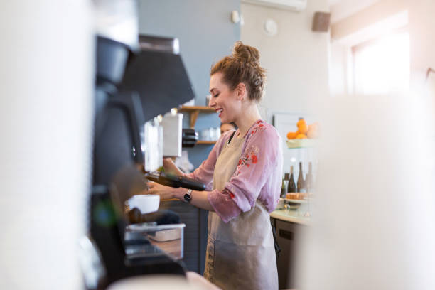 istock Woman working in coffee shop 1141431272