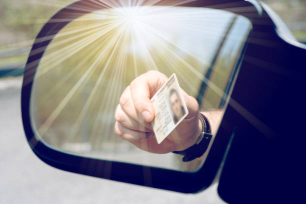 istock A Man shows off his ID card 1141432719