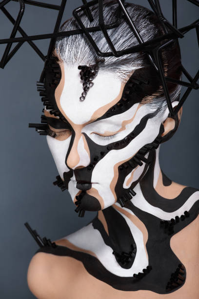 istock Female model with creative abstract makeup in futuristic hat 1141433629