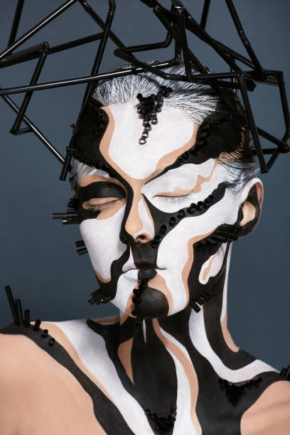 istock Female model with creative abstract makeup in futuristic hat 1141433655