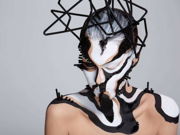 female model with creative abstract makeup in futuristic hat - beauty beautiful creativity stage makeup imagens e fotografias de stock