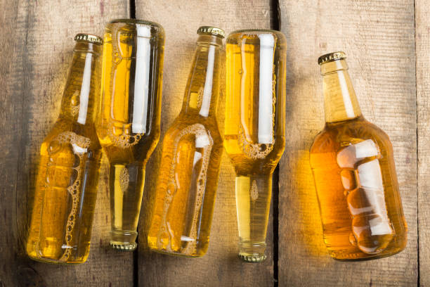 istock Beer bottles on a wooden table . 1141433883