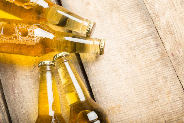 istock Beer bottles on a wooden table . 1141433937