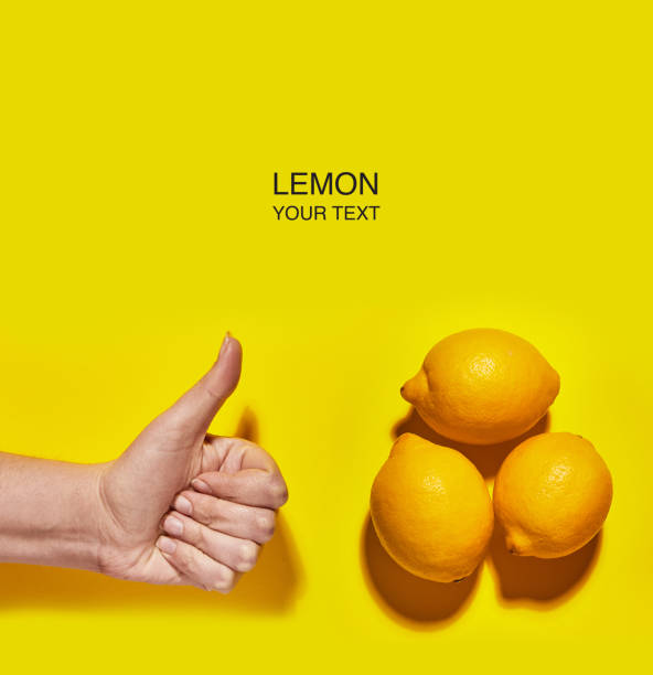 istock Creative layout made of lemon with thumbs up (Like) on yellow background. Flat lay, top view, copy space . Food concept. 1141434299