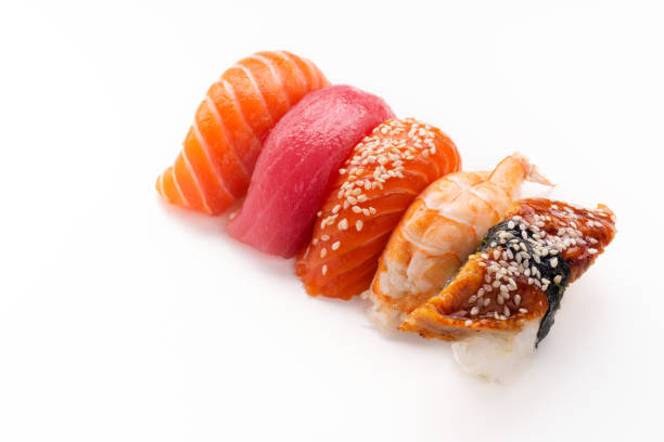 istock Creative layout with various sushi with eel, shrimp, salmon and tuna  on white background 1141435300