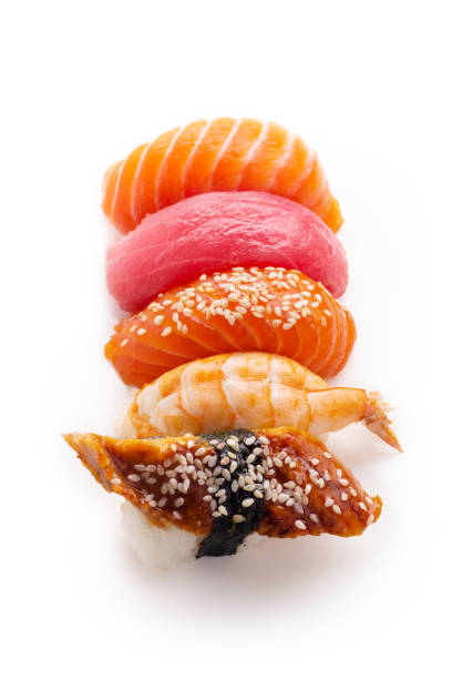 istock Creative layout with various sushi with eel, shrimp, salmon and tuna  on white background 1141435307