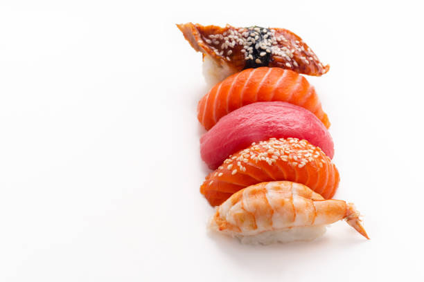 istock Creative layout with various sushi with eel, shrimp, salmon and tuna  on white background 1141435308