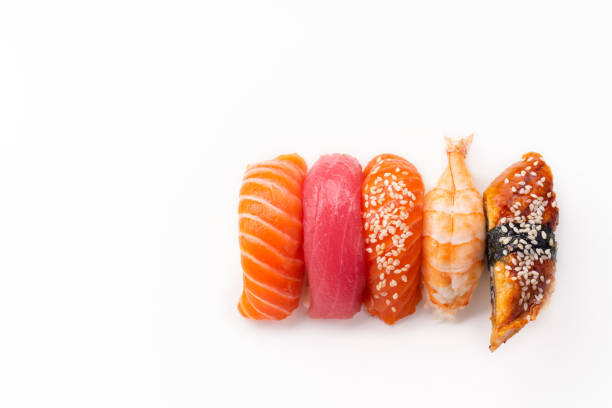 istock Creative layout with various sushi with eel, shrimp, salmon and tuna  on white background 1141435311