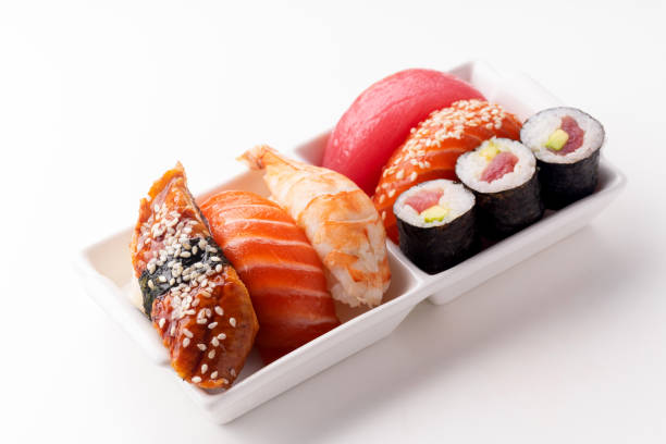 istock Creative layout with various sushi on white background. Shrimp, eel, salmon and tuna 1141435315