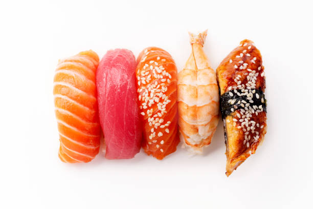 creative layout with various sushi with eel, shrimp, salmon and tuna  on white background - susi imagens e fotografias de stock