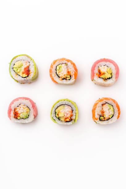 istock Flat lay with colorful sushi rolls with crab meat on white background 1141435363