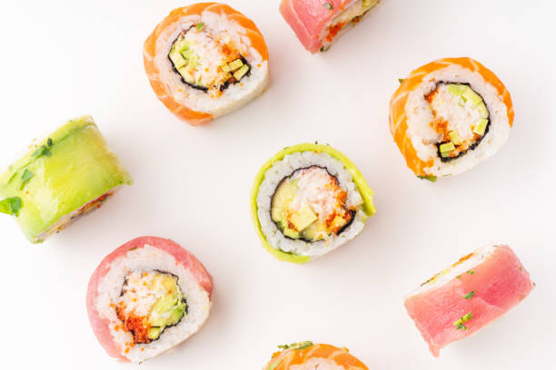istock Flat lay with colorful sushi rolls with crab meat on white background 1141435366