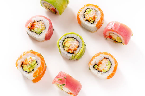 istock Flat lay with colorful sushi rolls with crab meat on white background 1141435367