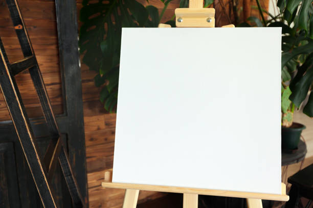 istock Wooden easel in the room 1141437296