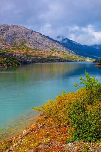 A turquoise coloured lake in the mountains of Yukon, Alaska.