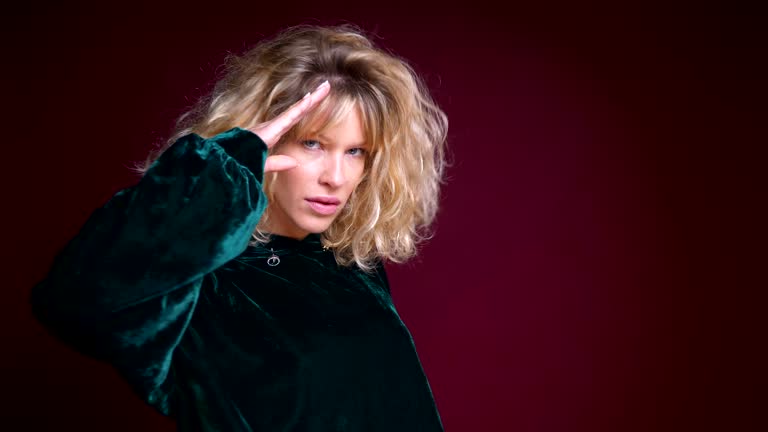 Closeup portrait of young beautiful caucasian female gesturing and having fun in front of the camera