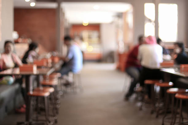 Blurred background of people who is visitig cafe. Morning concept.